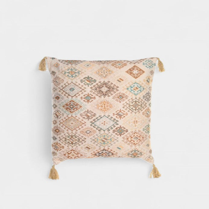Coussin décoratif à motifs ethniques avec pompons